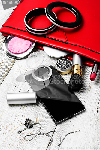 Image of Red clutch bag and ladies accessories