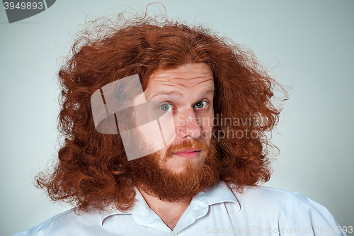 Image of Portrait of young man with shocked facial expression