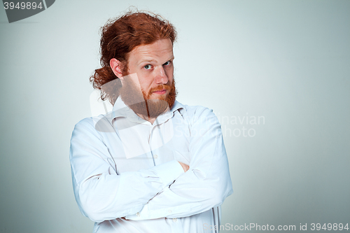 Image of Portrait of young man with shocked facial expression