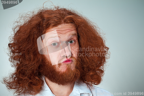 Image of Portrait of young man with shocked facial expression