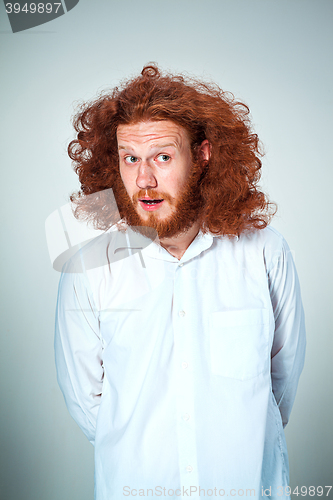 Image of Portrait of young man with shocked facial expression