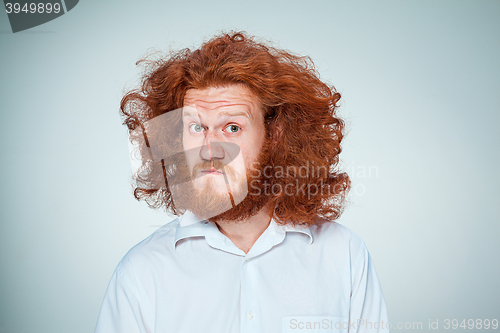 Image of Portrait of young man with shocked facial expression