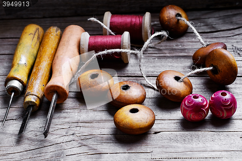 Image of beads and set of tools