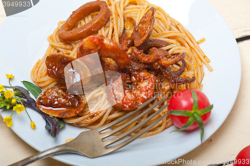 Image of Italian seafood spaghetti pasta on red tomato sauce 