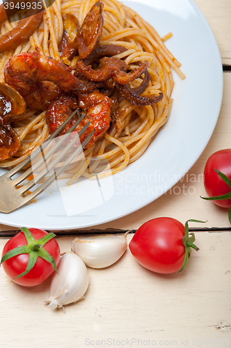 Image of Italian seafood spaghetti pasta on red tomato sauce 