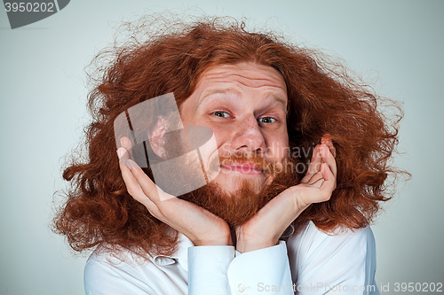 Image of Portrait of young man with shocked facial expression