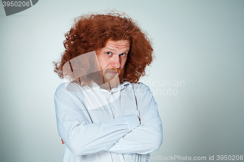 Image of Portrait of young man with shocked facial expression