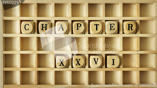 Image of wooden game with the word chapter twenty six