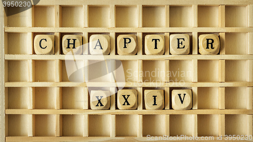 Image of wooden game with the word chapter twenty four