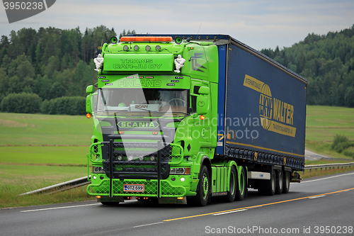 Image of Lime Green Scania Semi Show Truck on the Road