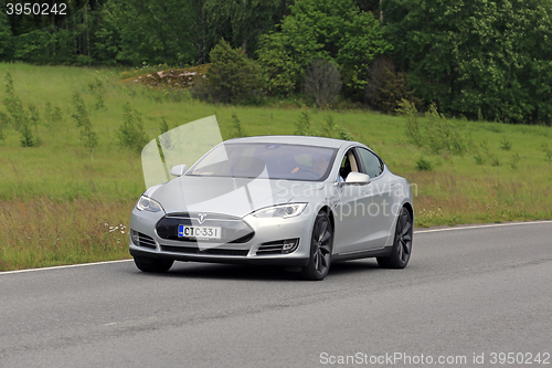 Image of Tesla Model S Electric Car on Summer Road