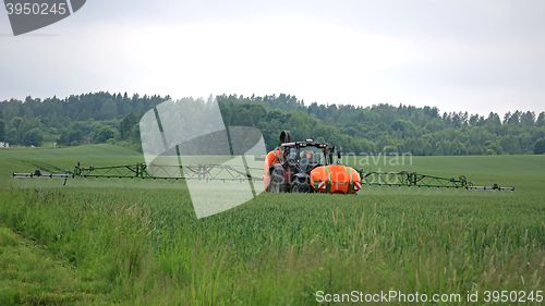 Image of Tractor and Sprayer on Wheat Field