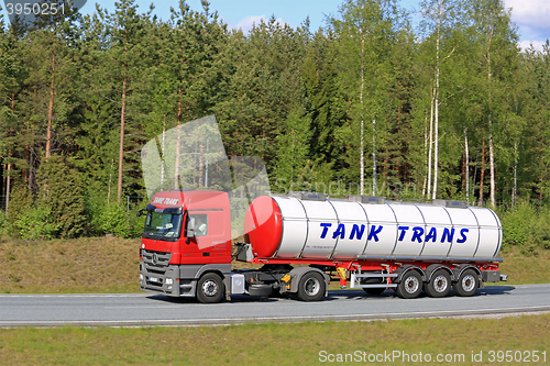 Image of Red Mercedes-Benz Actros Semi Tank Truck on Freeway