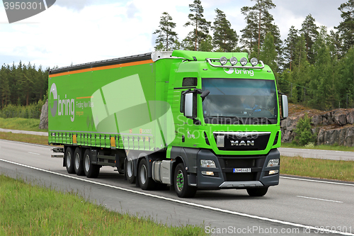 Image of Lime Green MAN TGX Cargo Truck on Motorway