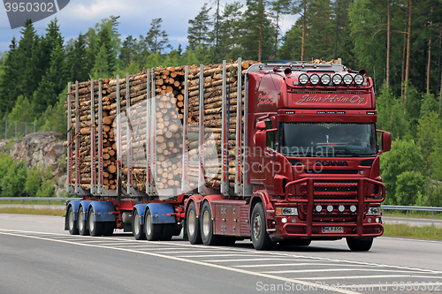 Image of Red Scania Logging Truck Pulp Wood Haul on Motorway