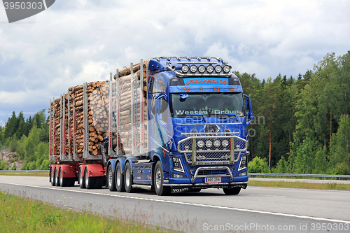 Image of Customized Volvo FH16 Transports Pulp Wood along Freeway