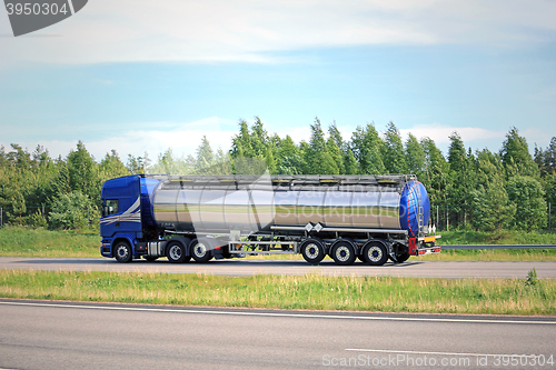 Image of Blue Semi Tank Truck on Freeway at Summer