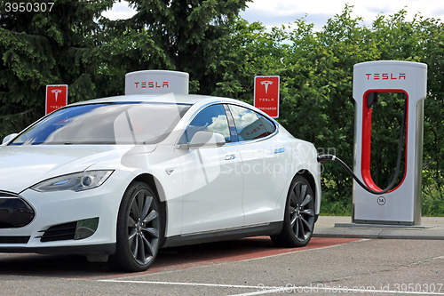 Image of White Tesla Model S Electric Car Charging Battery