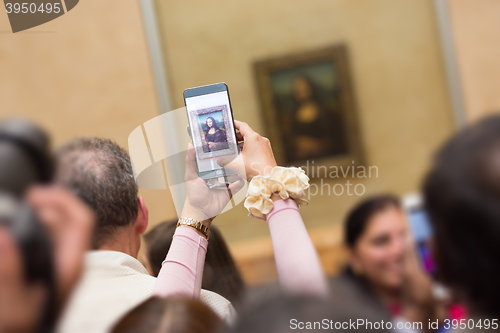 Image of Leonardo DaVinci\'s Mona Lisa in Louvre Museum.