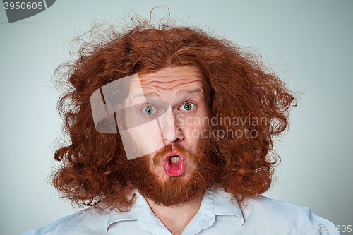 Image of Portrait of young man with shocked facial expression