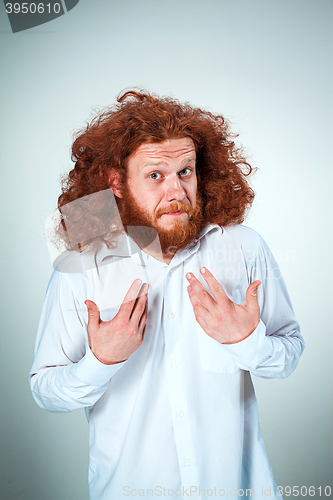 Image of Portrait of young man with shocked facial expression