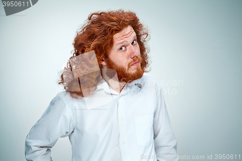 Image of Portrait of young man with shocked facial expression