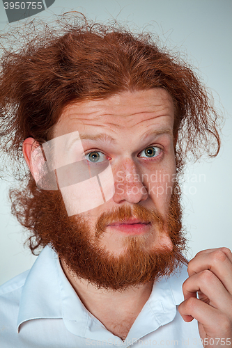 Image of Portrait of young man with shocked facial expression