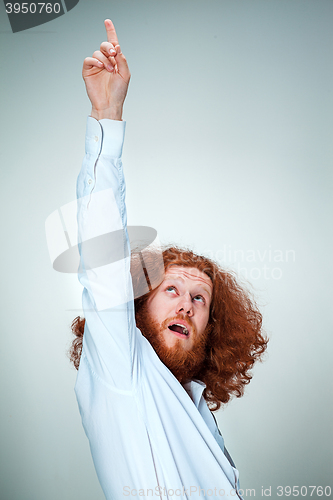 Image of Portrait of young man with shocked facial expression