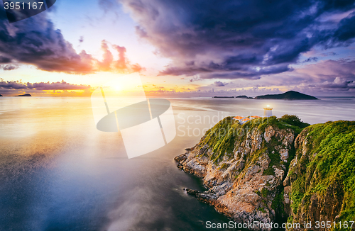 Image of Hong Kong lighthouse during sunrise