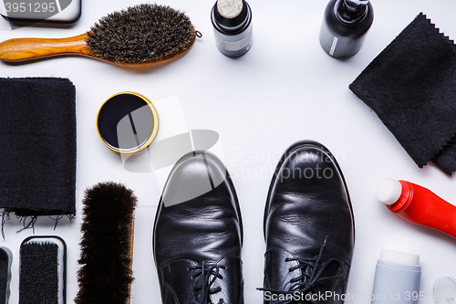 Image of Cleaning boots concept on white background