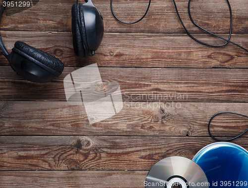 Image of top view of music cd player equipment on wooden desk