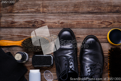 Image of Shoe wax, brush and boot