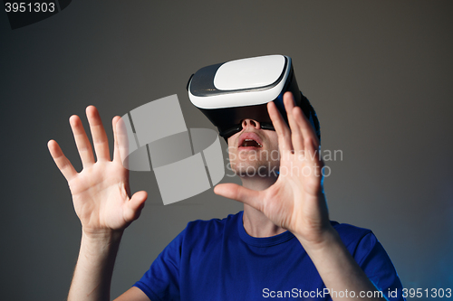 Image of Young man using a VR googles.