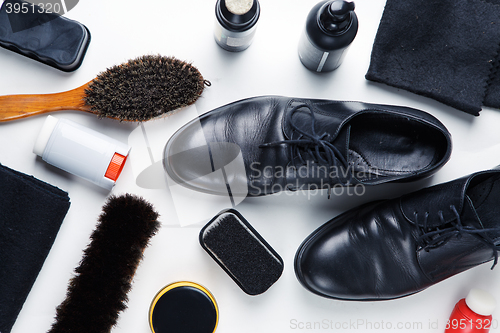 Image of Cleaning boots concept on white background