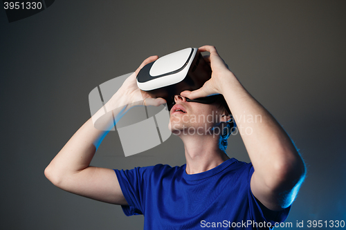 Image of Man wearing virtual reality goggles.