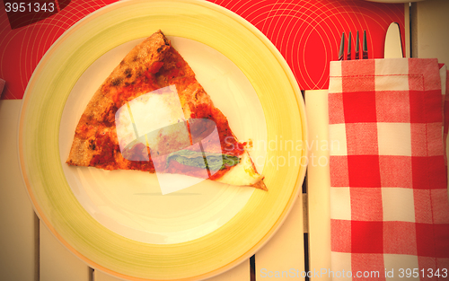 Image of Pizza Margherita with basil leaves