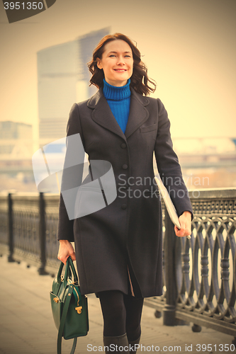 Image of smiling office worker outdoors