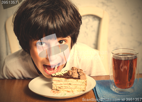 Image of boy and birthday cake