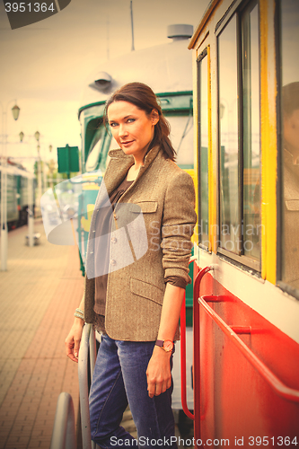 Image of woman on the background of the train