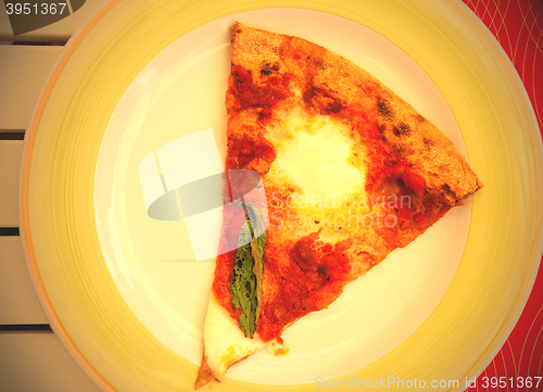 Image of margarita pizza slice on a plate