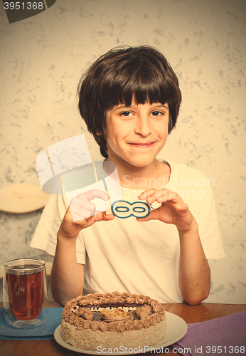 Image of boy birthday with a sign infinity