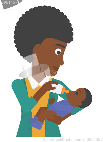 Image of Woman feeding baby.