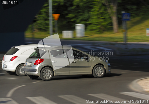 Image of Two cars in motion