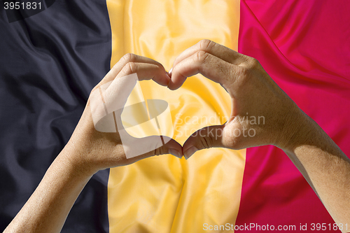 Image of Hands heart symbol, Belgium flag