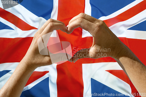 Image of Hands heart symbol, UK flag