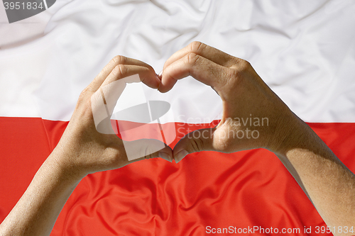 Image of Hands heart symbol, Poland flag