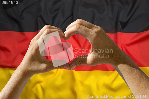 Image of Hands heart symbol, Germany flag