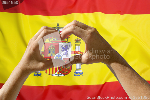 Image of Hands heart symbol, Spain flag