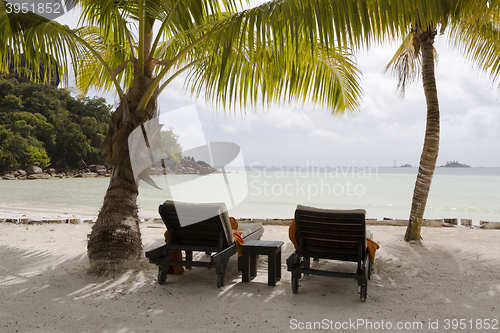 Image of Deckchairs at tropical landscape view, Seychelles