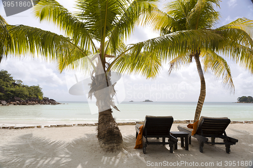 Image of Deckchairs at tropical landscape view, Seychelles